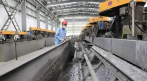 “Industrial caustic soda usage in factory – high-purity NaOH handled safely for chemical, soap, and paper production