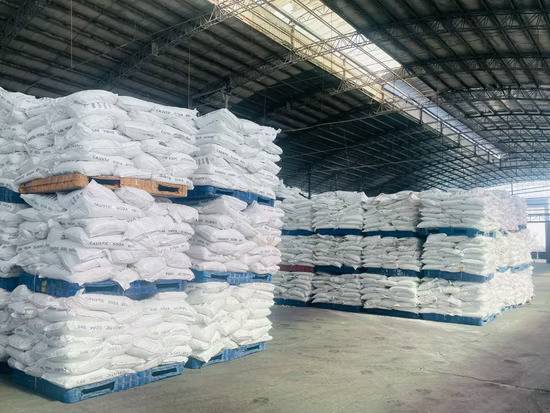 Bags of caustic soda pearls in a warehouse